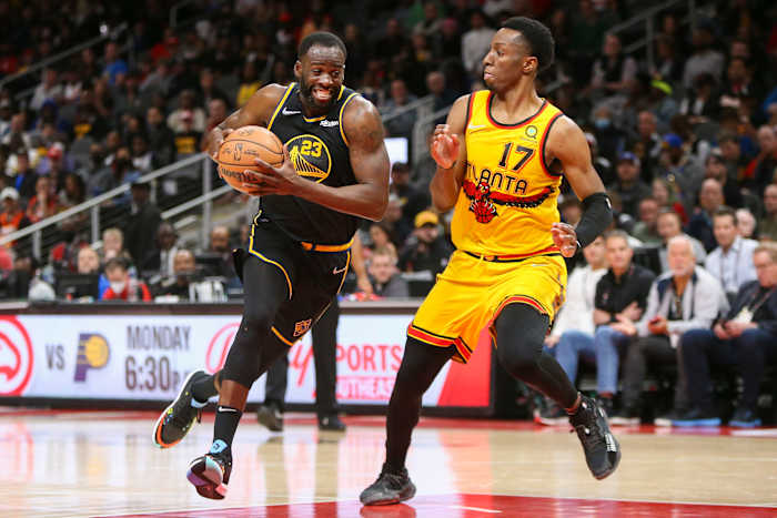 Golden State Warriors forward Draymond Green (23) drives on Atlanta Hawks forward Onyeka Okongwu.